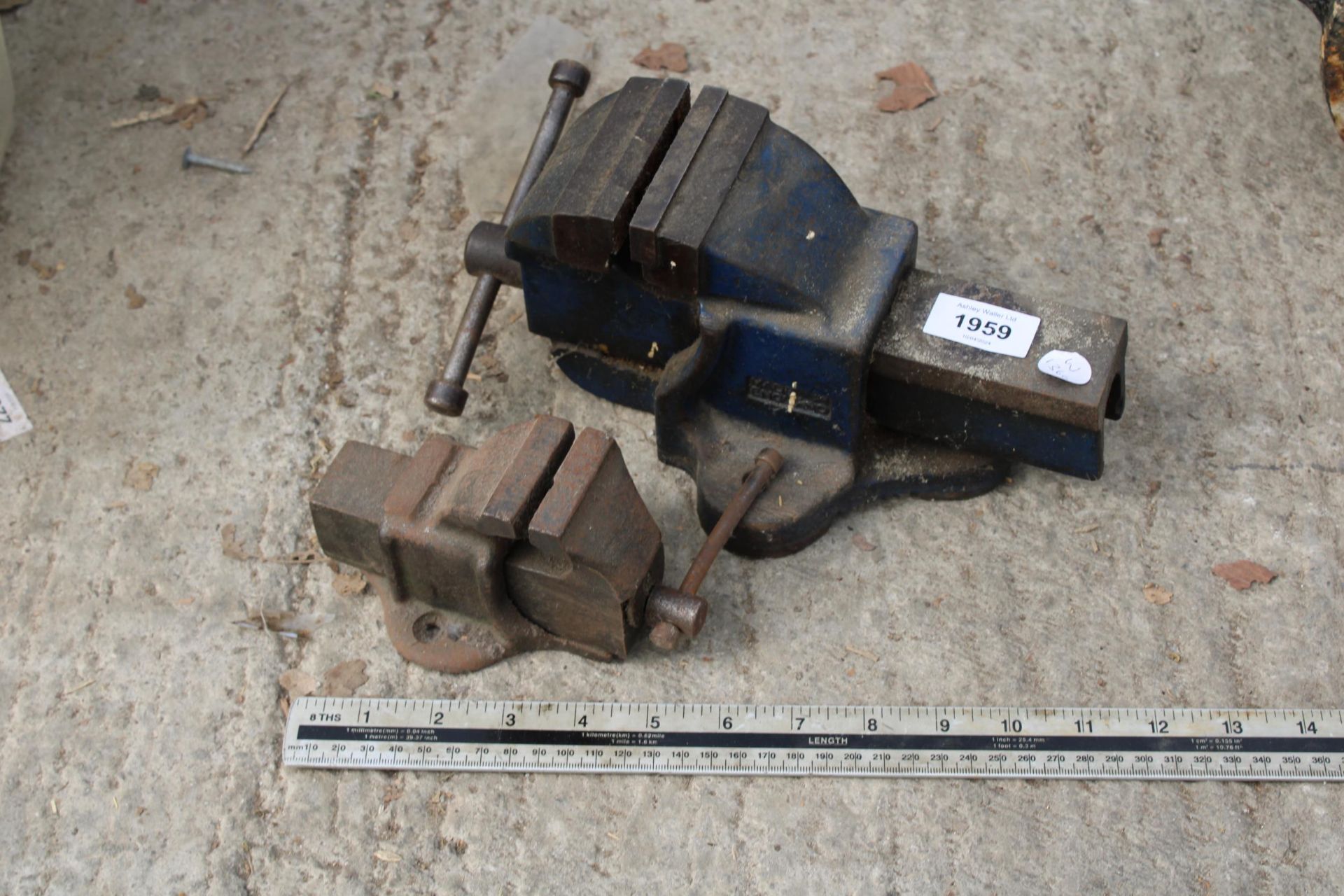 A SMALL WODEN BENCH VICE AND A FURTHER MINIATURE BENCH VICE