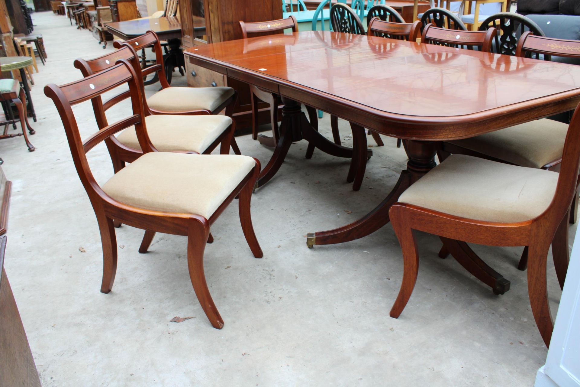 A MAHOGANY REGENCY STYLE EXTENDING TWIN PEDESTAL DINING TABLE 62" X 38" (LEAF 21") AND SIX BRASS - Image 3 of 6