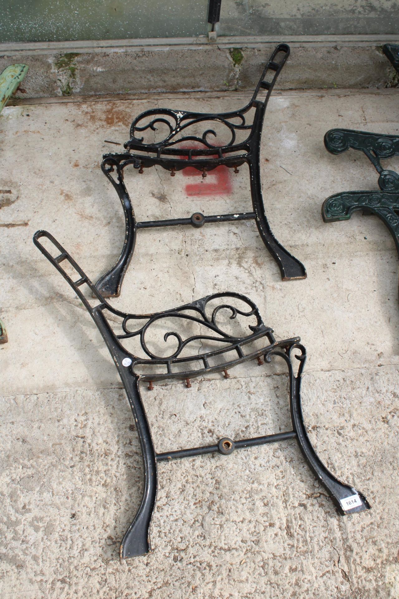 A PAIR OF DECORATIVE CAST BENCH ENDS