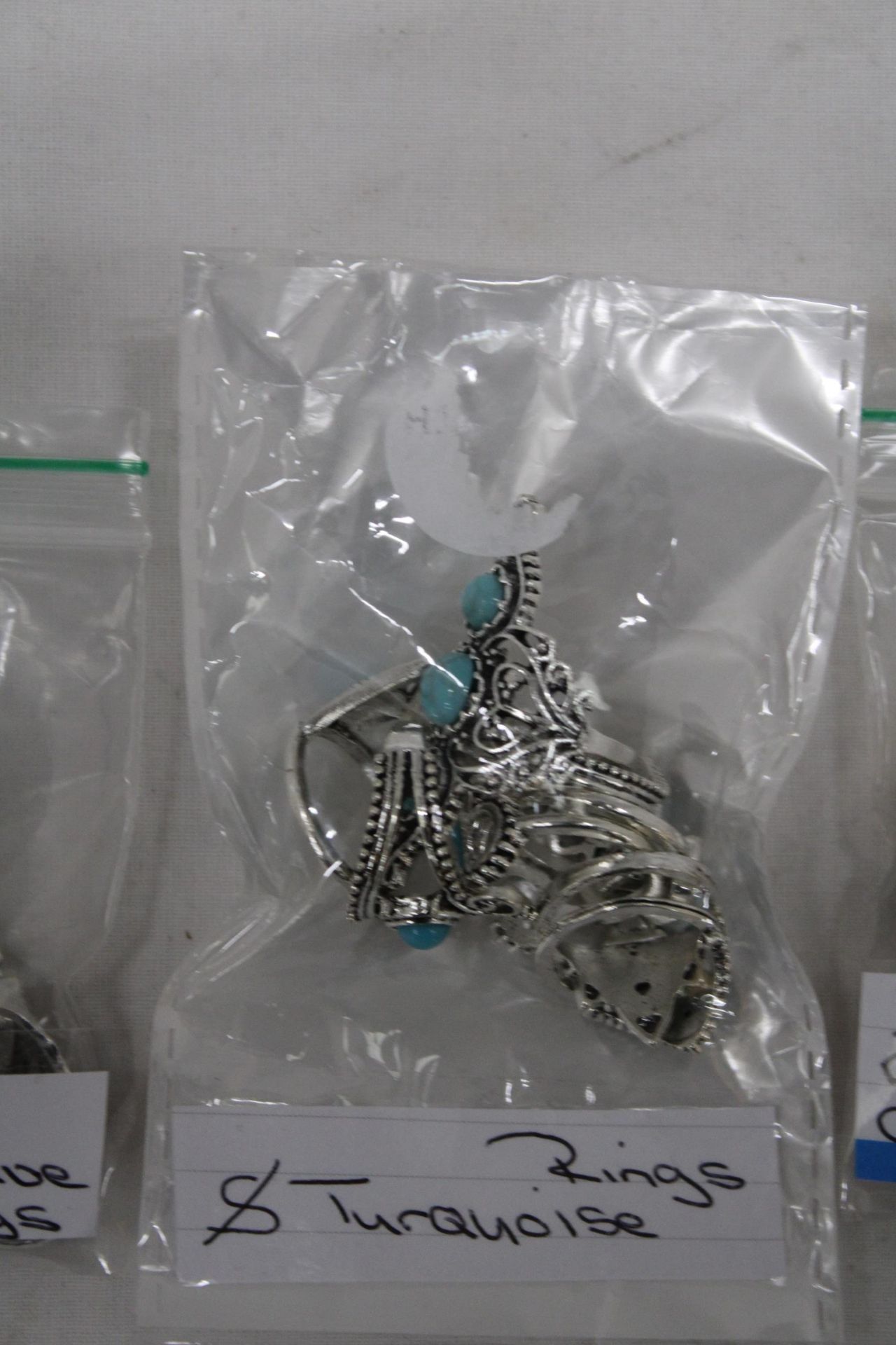 A QUANTITY OF COSTUME JEWELLERY TO INCLUDE TURQUOISE RINGS, CLIP ON EARRINGS AND TENNIS BRACELETS - Image 3 of 5