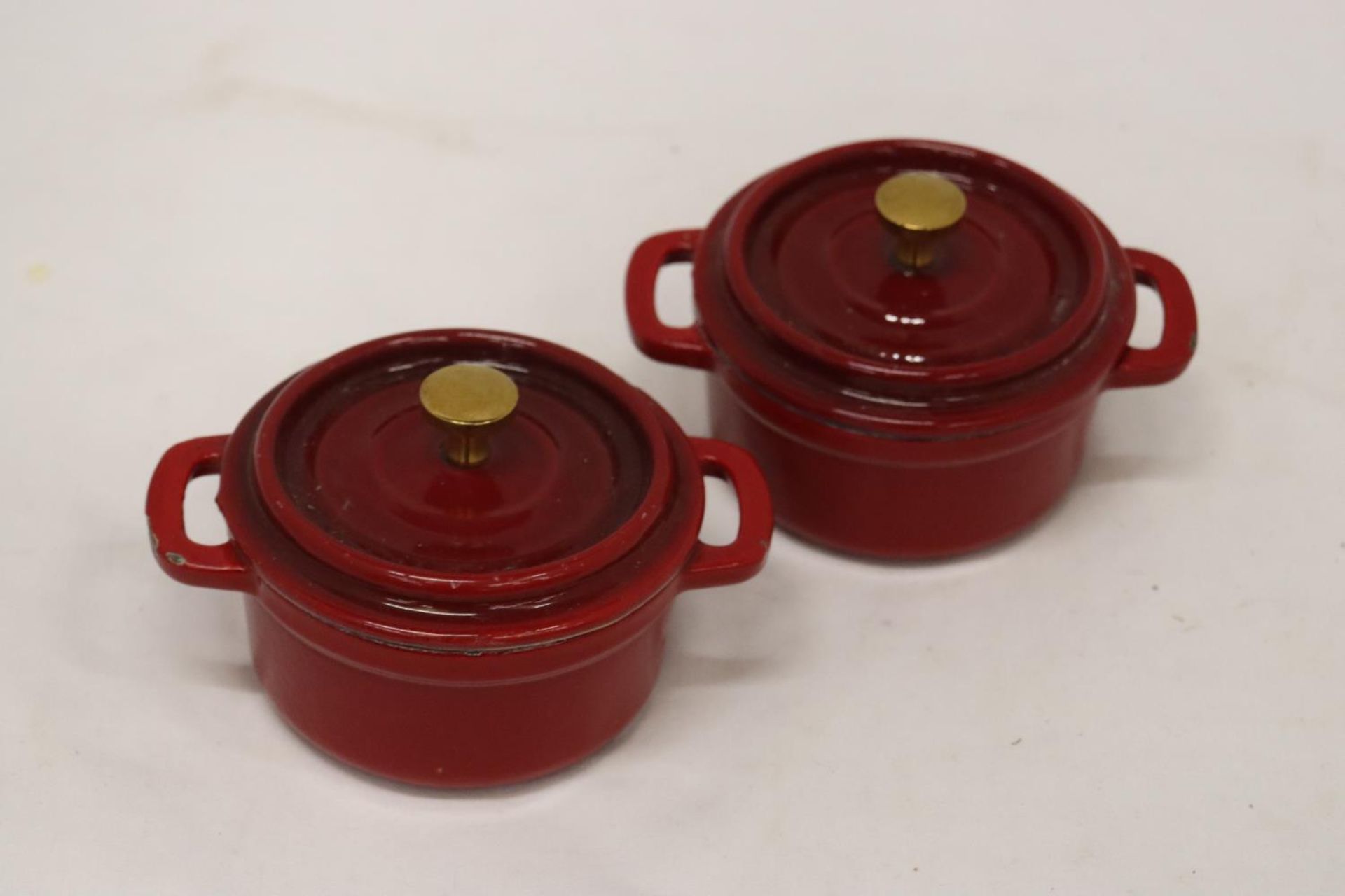 TWO MINI CAST IRON LIDDED COOKING POTS