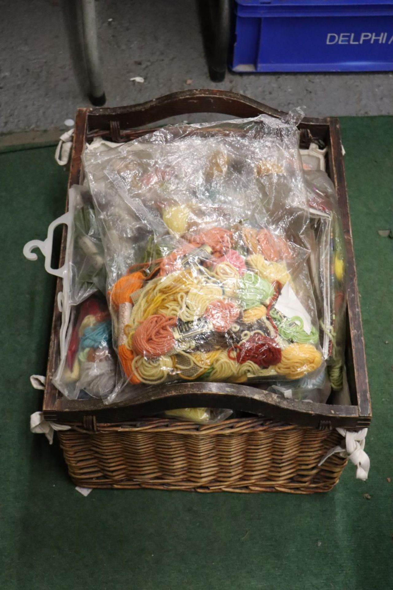 A LARGE BASKET OF TAPESTRY WOOL