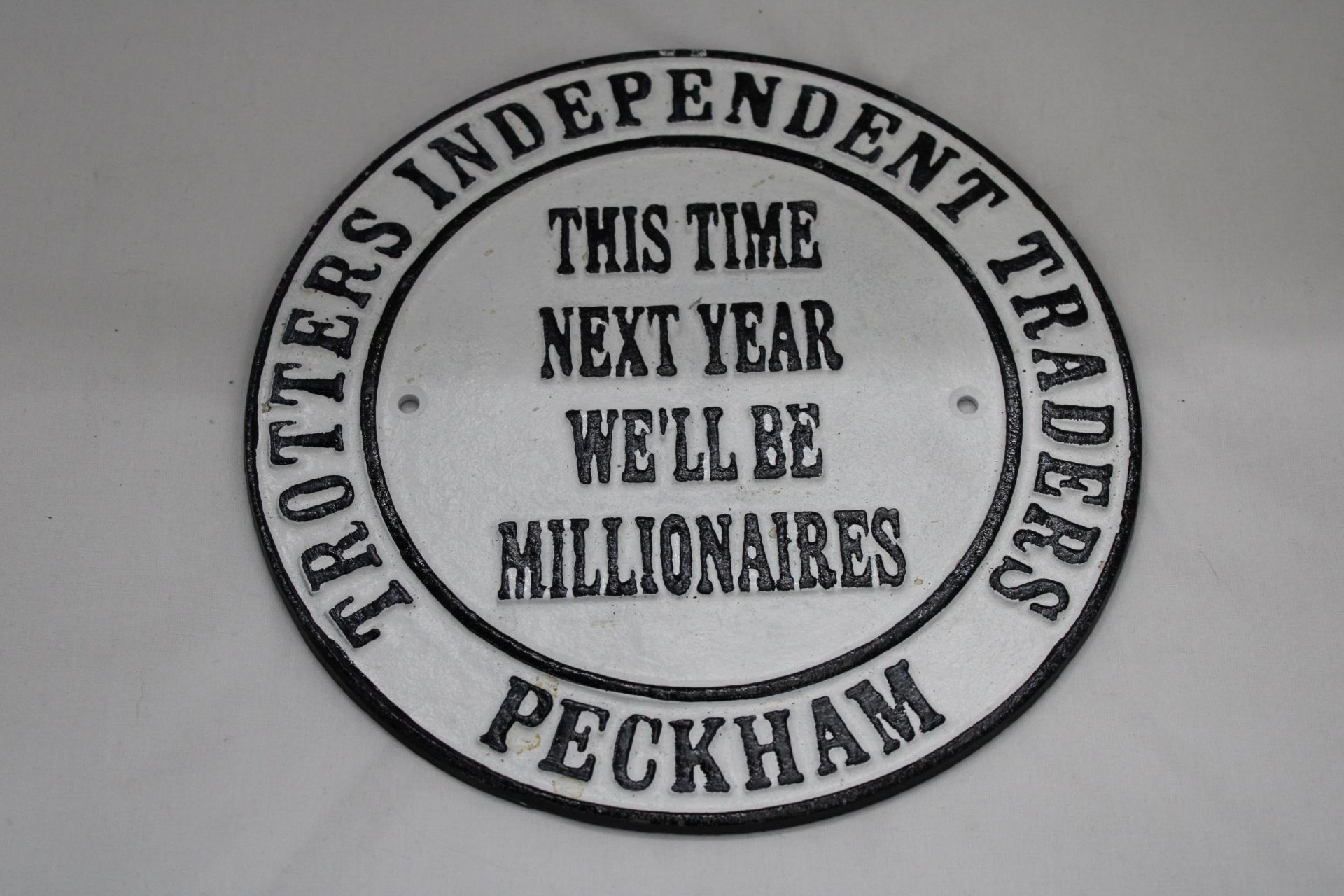 A 'THIS TIME NEXT YEAR, WE'LL BE MILLIONAIRES PLAQUE', DIAMETER 23CM
