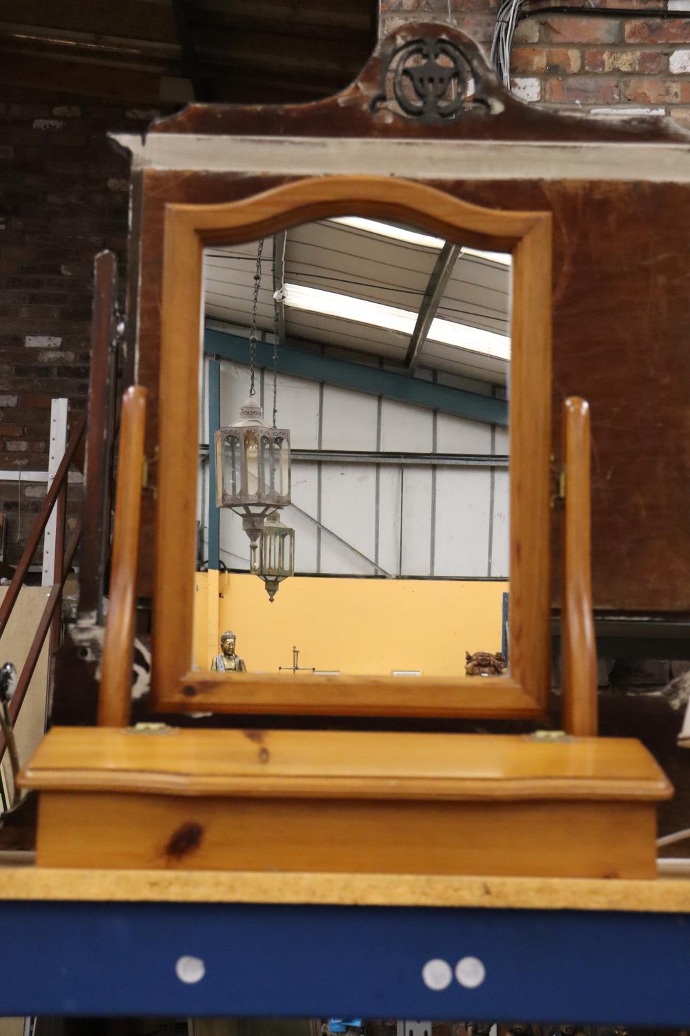 A PINE TOILET MIRROR WITH STORAGE TO THE BASE