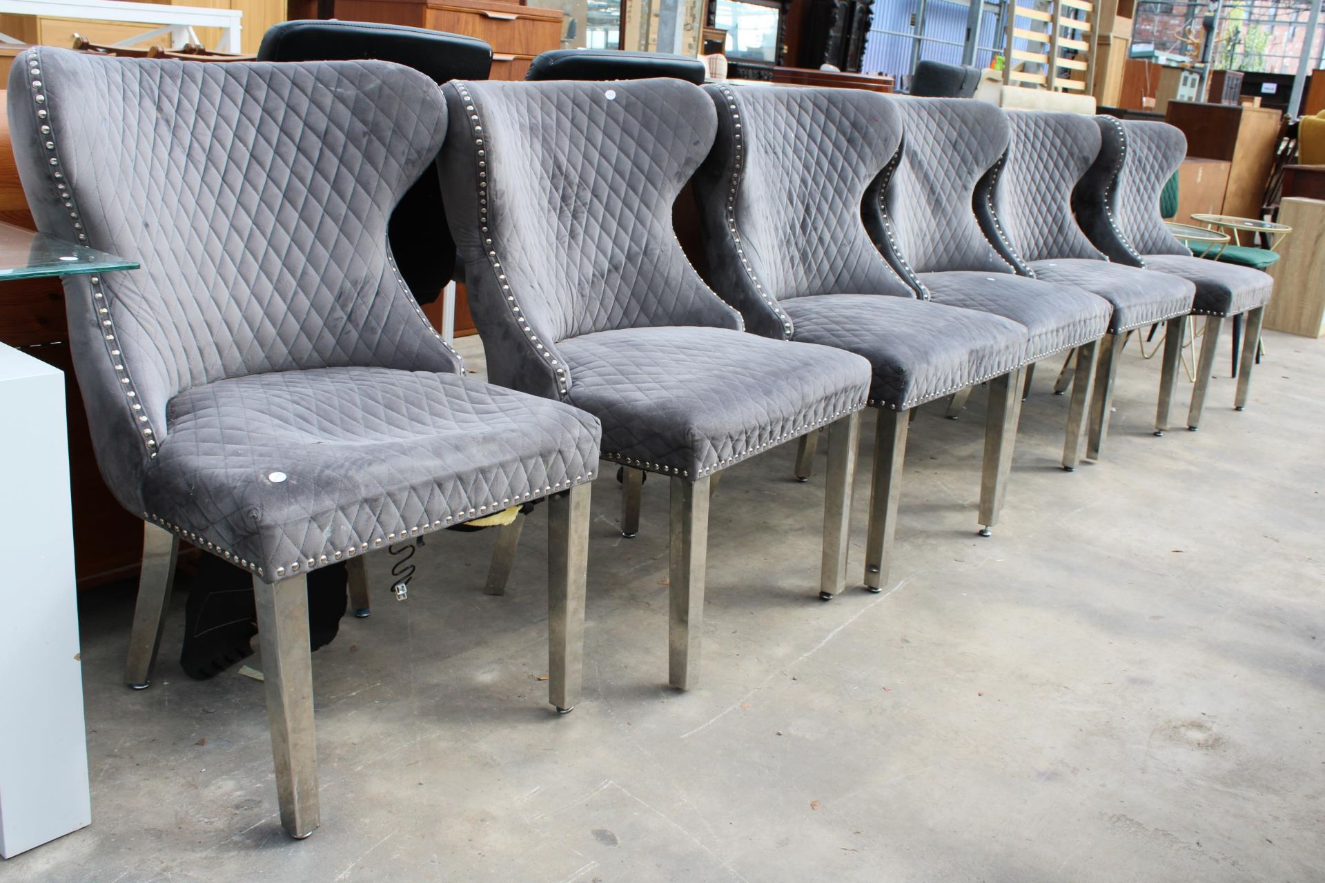 A SET OF SIX MODERN WINGED DINING CHAIRS ON POLISHED CHROME LEGS WITH LION MASK HANDLES TO BACKS - Image 3 of 3