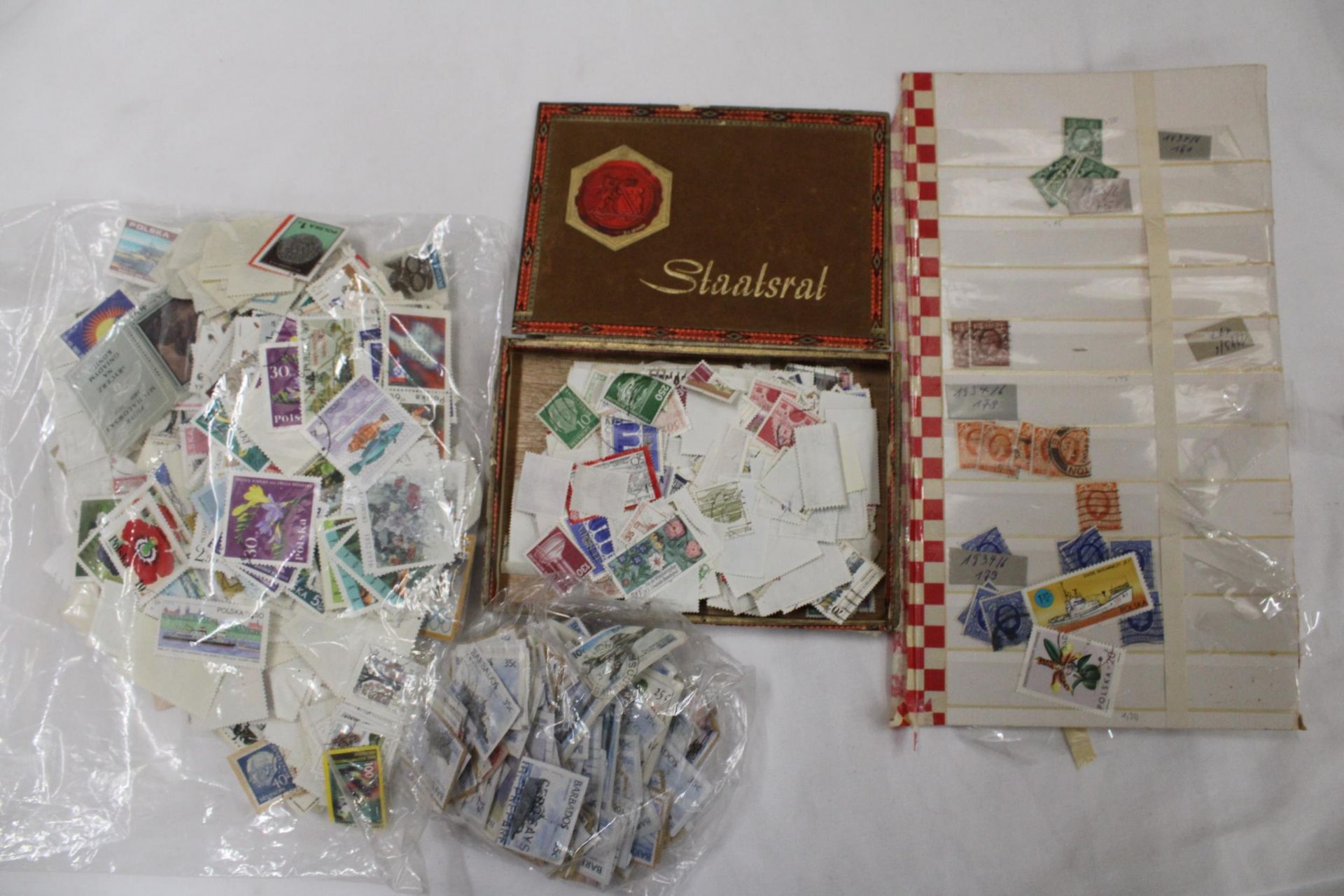 A LARGE QUANTITY OF LOOSE STAMPS FROM AROUND THE WORLD
