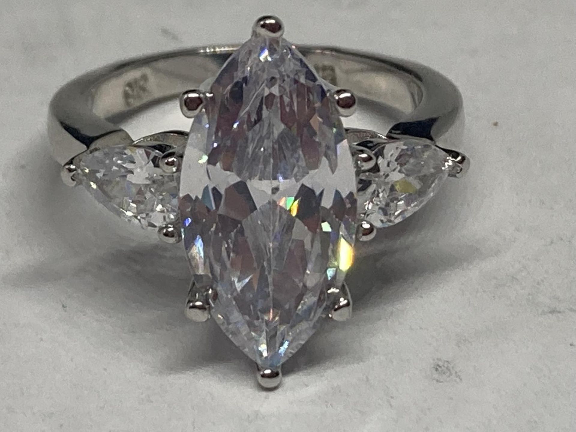 A MARKED 9K RING WITH 5 CARATS OF MOISSANITE SIZE L/M GROSS WEIGHT 4.85 GRAMS