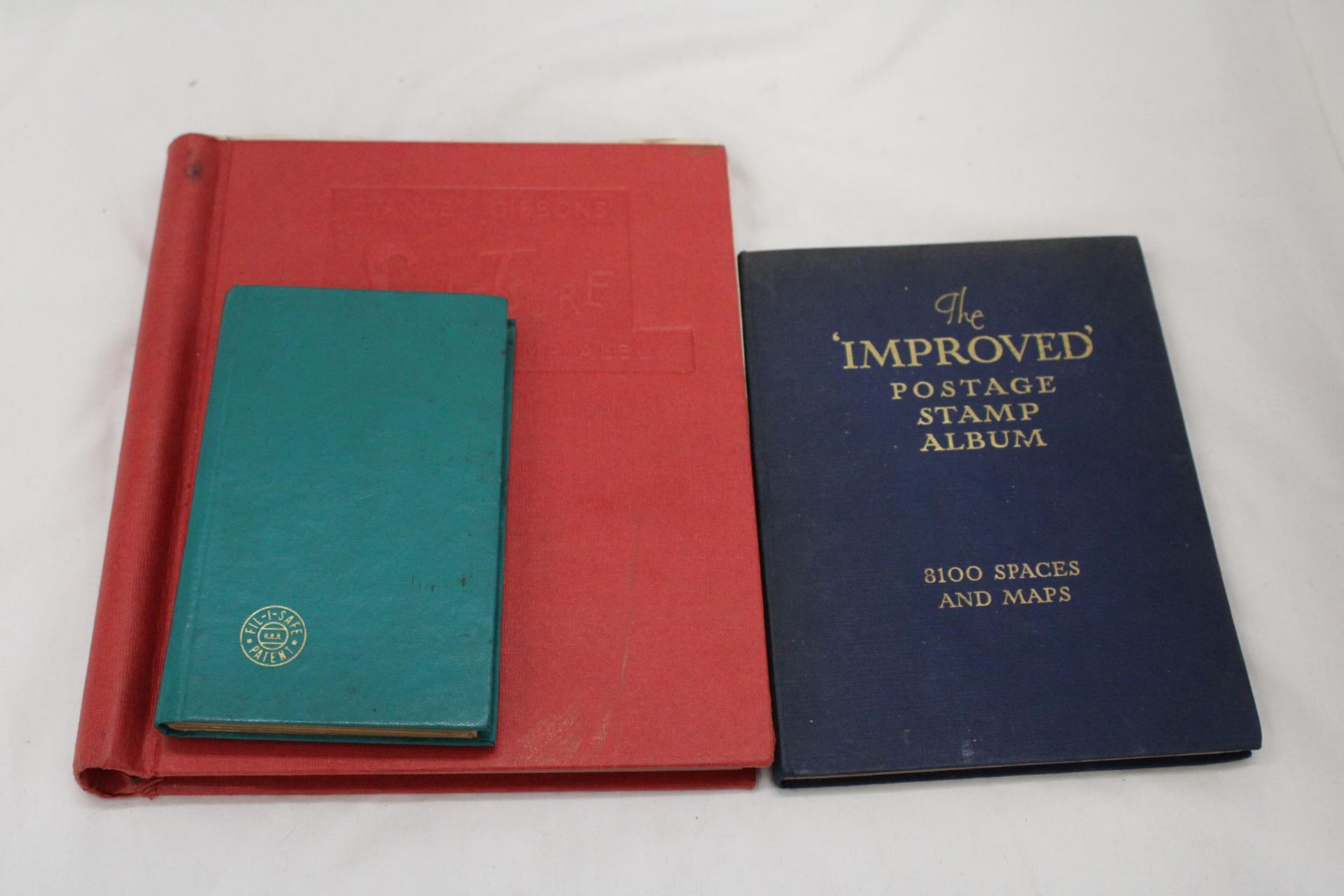 THREE VINTAGE STAMP ALBUMS