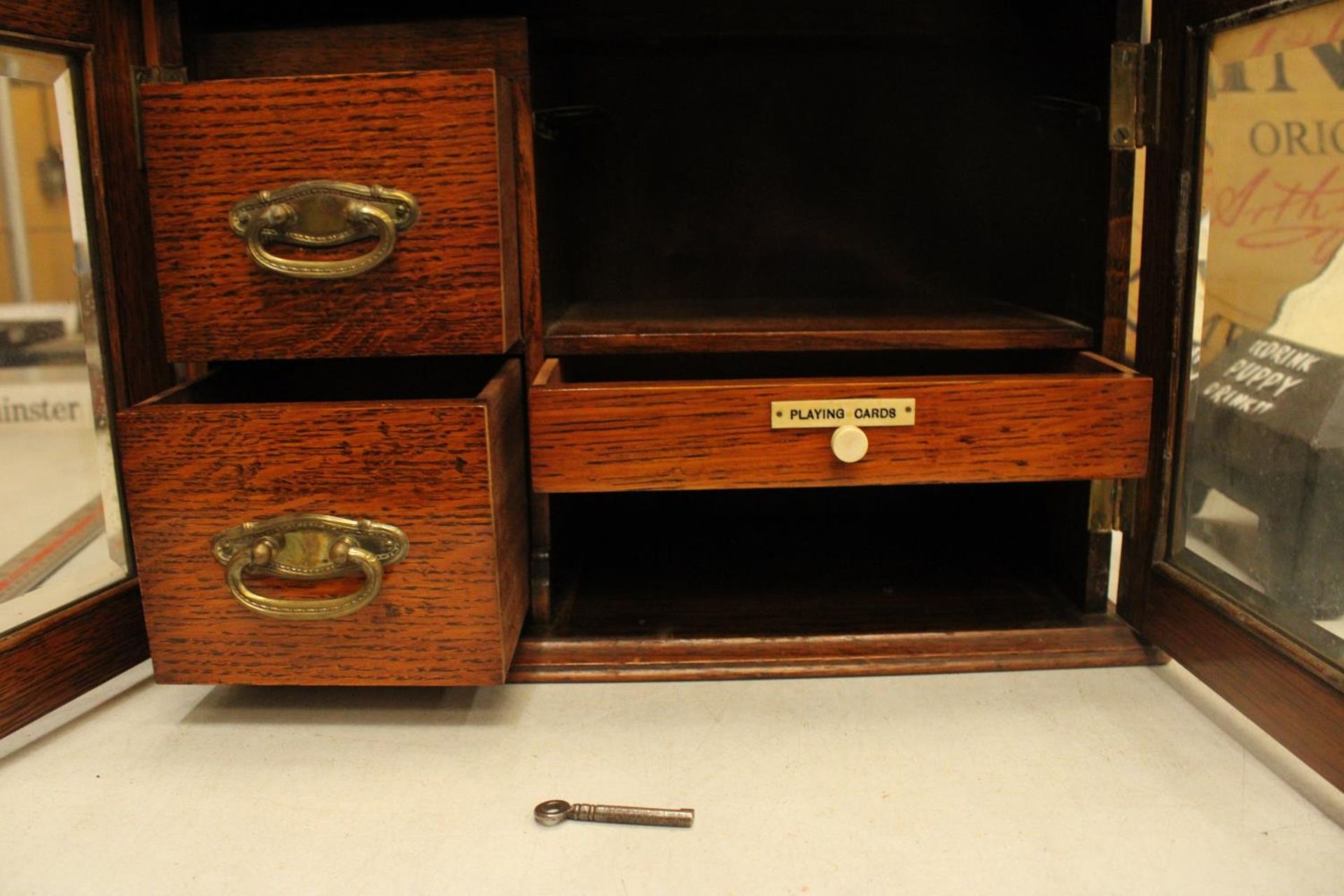 AN OAK TWO GLASS DOOR SMOKERS CABINET WITH THREE INTERIOR DRAWERS ONE LABELED PLAYING CARDS COMPLETE - Image 3 of 4