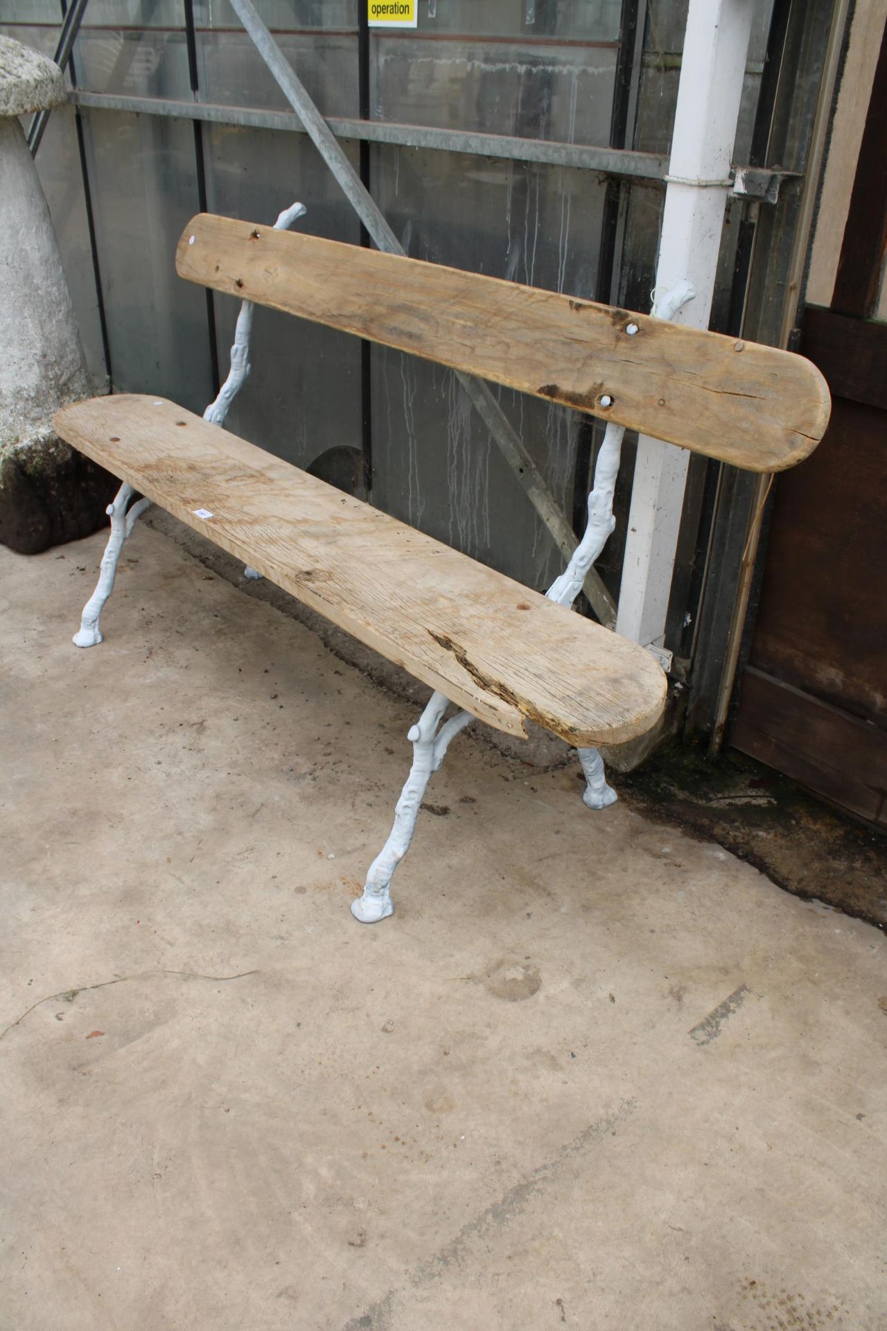 A 19TH CENYURY FRENCH GARDEN BENCH WITH FRENCH CAST IRON FAUX BOIS LEGS