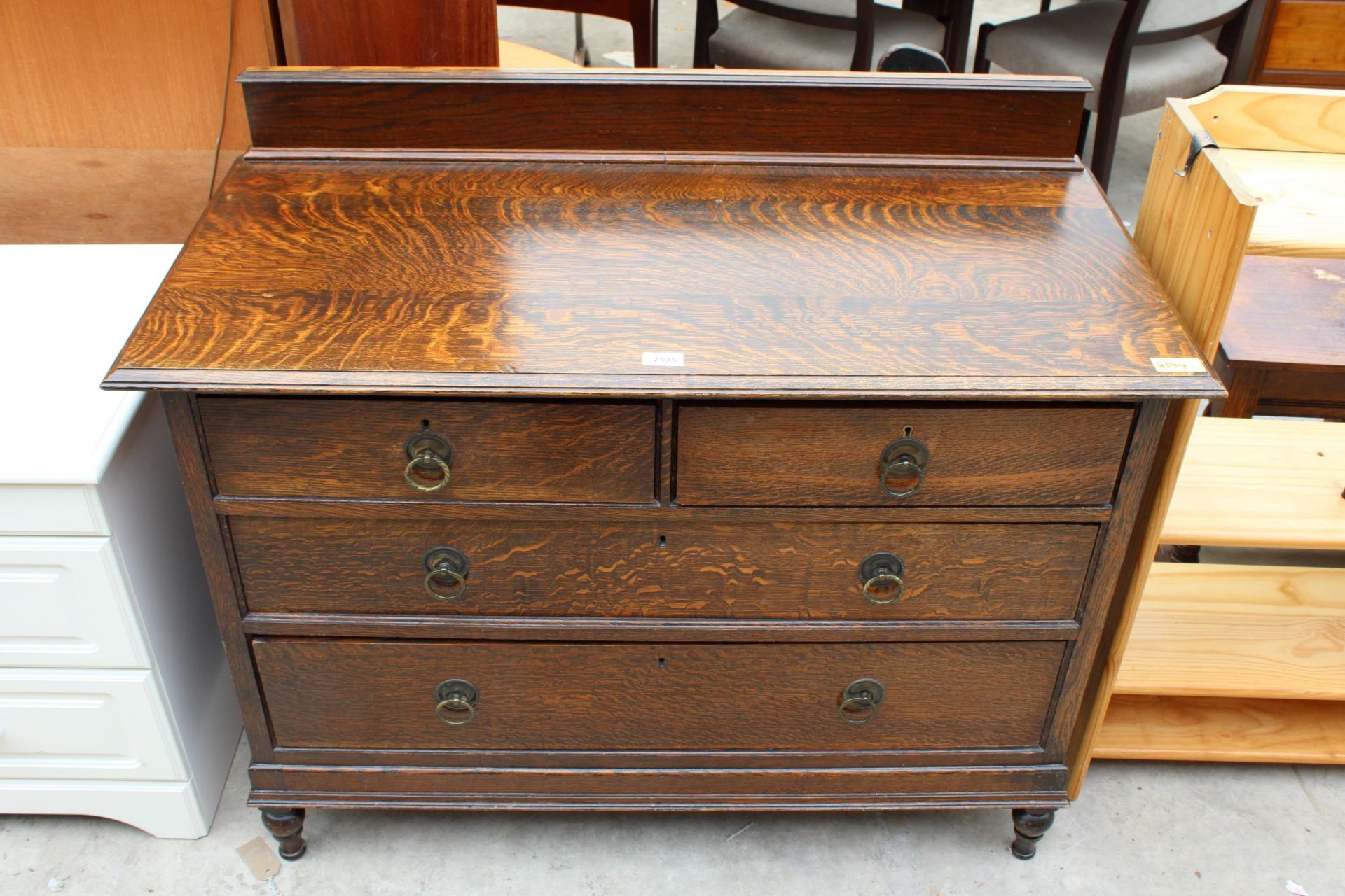 AN EARLY 20TH CENTURY OAK CHEST OF TWO SHORT AND TWO LONG DRAWERS 42" WIDE WITH HUNTER & CO