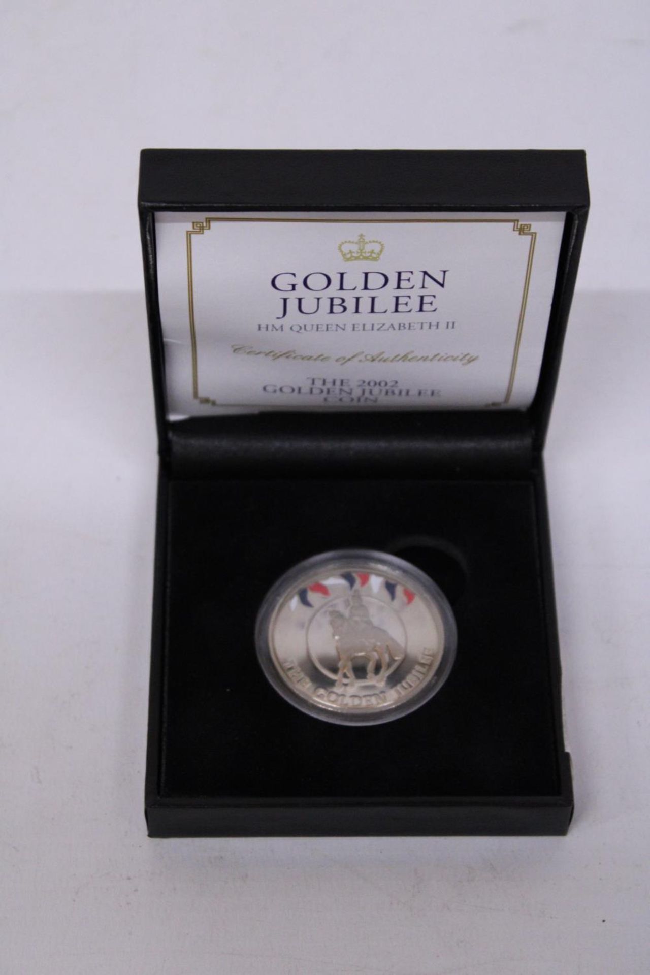 A GOLDEN JUBILEE HM QUEEN ELIZABETH 2002 50P COIN IN PRESENTATION BOX WITH CERTIFICATE OF