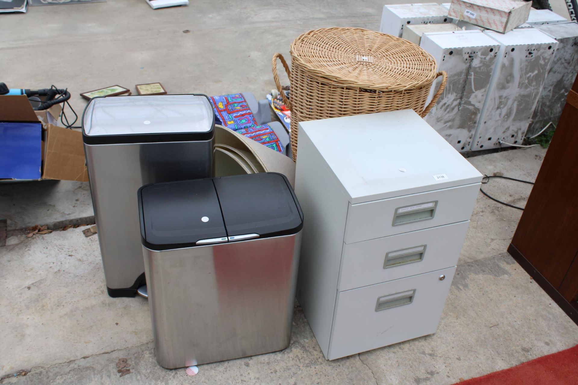 AN ASSORTMENT OF ITEMS TO INCLUDE A WICKER BASKET, A FILING CABINET AND BINS ETC