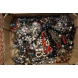 A LARGE QUANTITY OF COSTUME JEWELLERY, NECKLACES, BANGLES, ETC