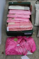 A QUANTITY OF NEW BEDDING AND CURTAINS IN PACKAGING TO INCLUDE TWO PAIRS OF CURTAINS AND FOUR