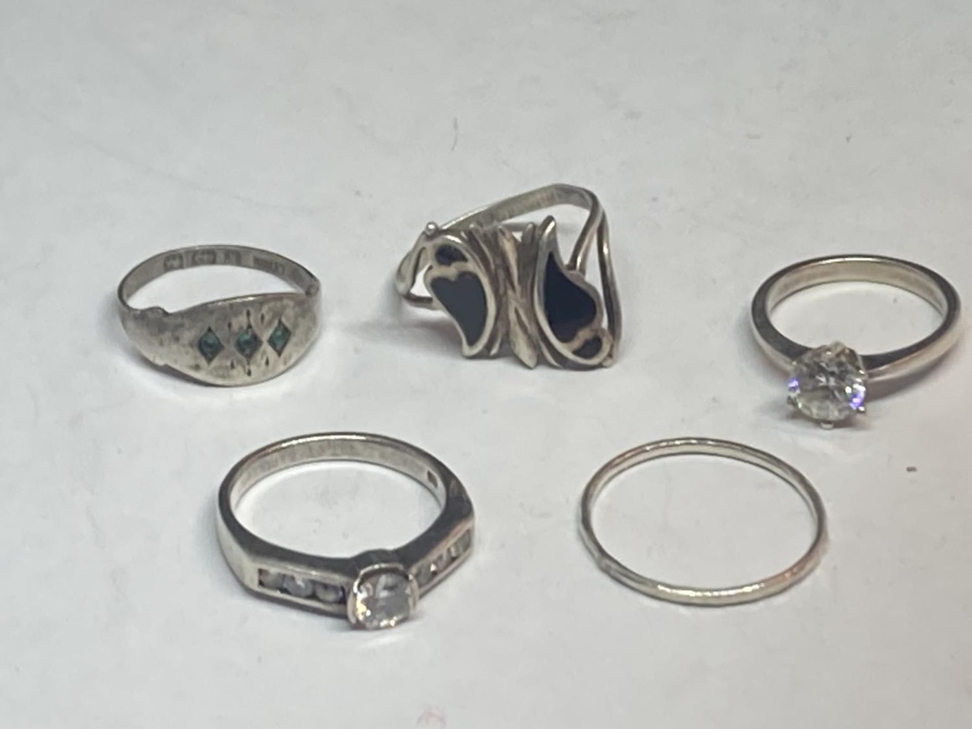 FIVE SILVER RINGS