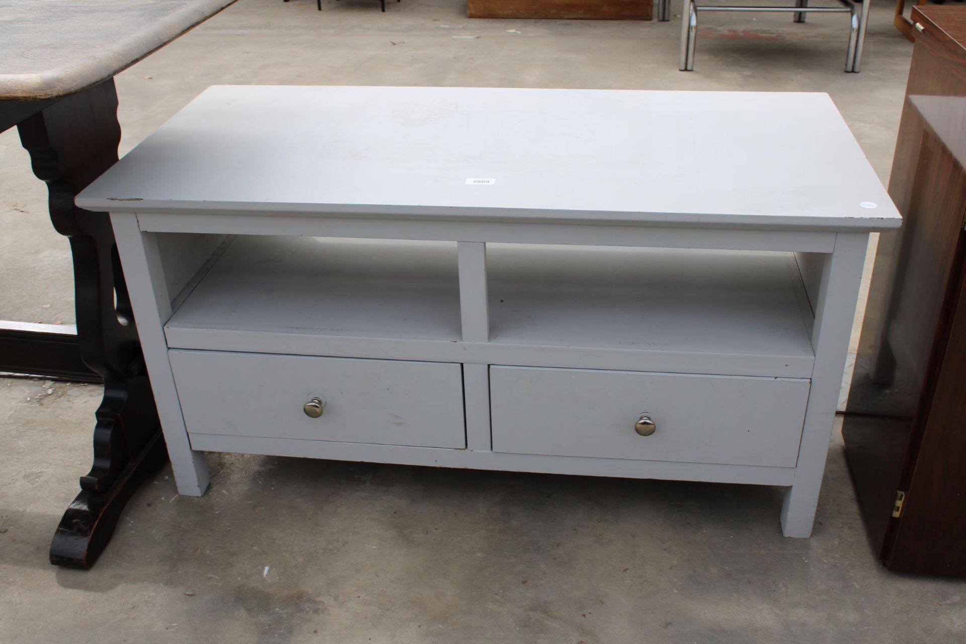 A MODERN PAINTED TWO TIER SIDE TABLE WITH TWO DRAWERS