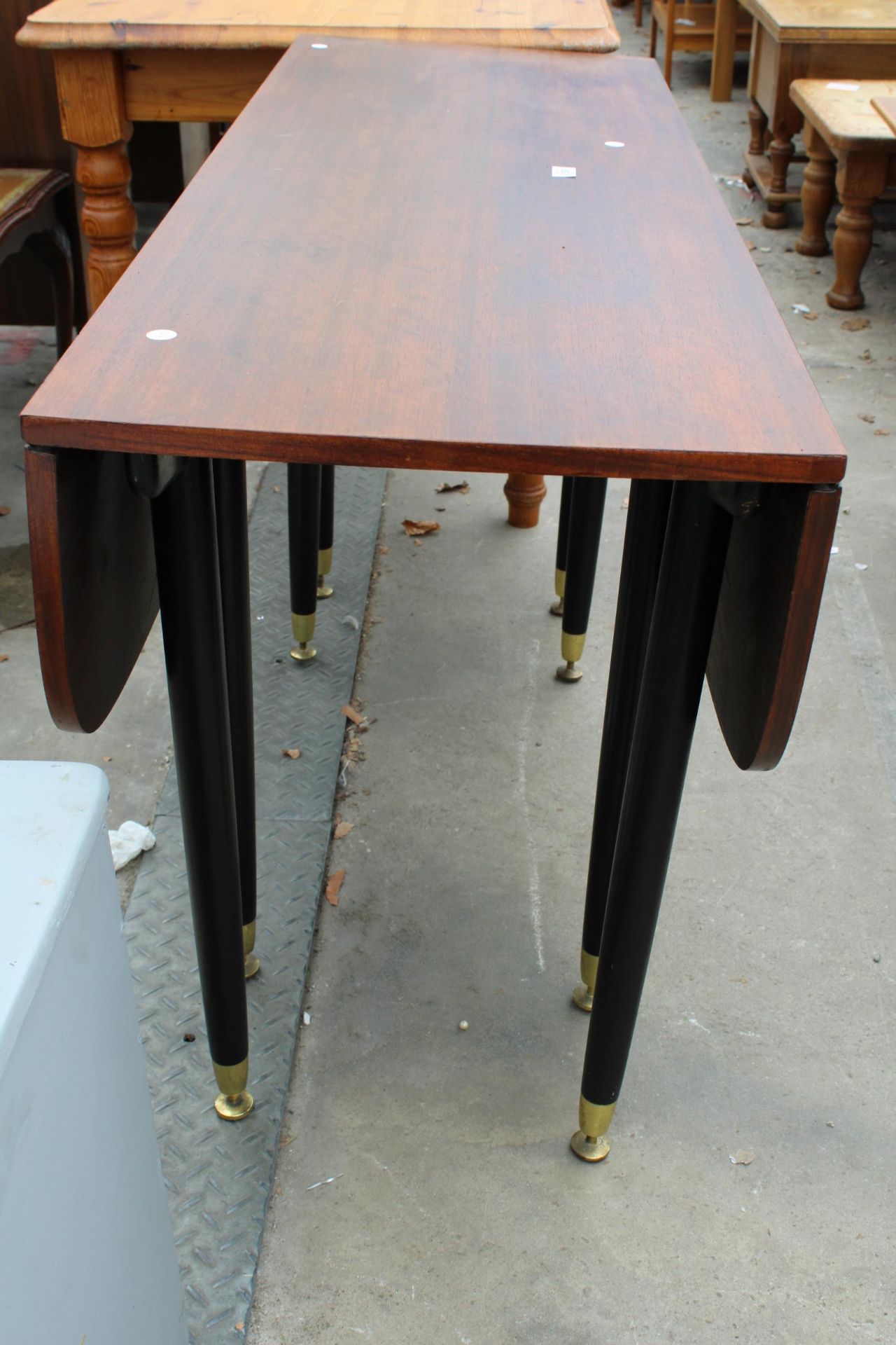 A RETRO TOLA WOOD POSSIBLY G PLAN E GOMME LIBRENZA (NO LABEL) DROP LEAF DINING TABLE ON BLACK - Image 2 of 3