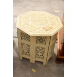 A PAINTED INDIAN HARDWOOD OCTAGONAL TABLE ON FOLDING FRAME