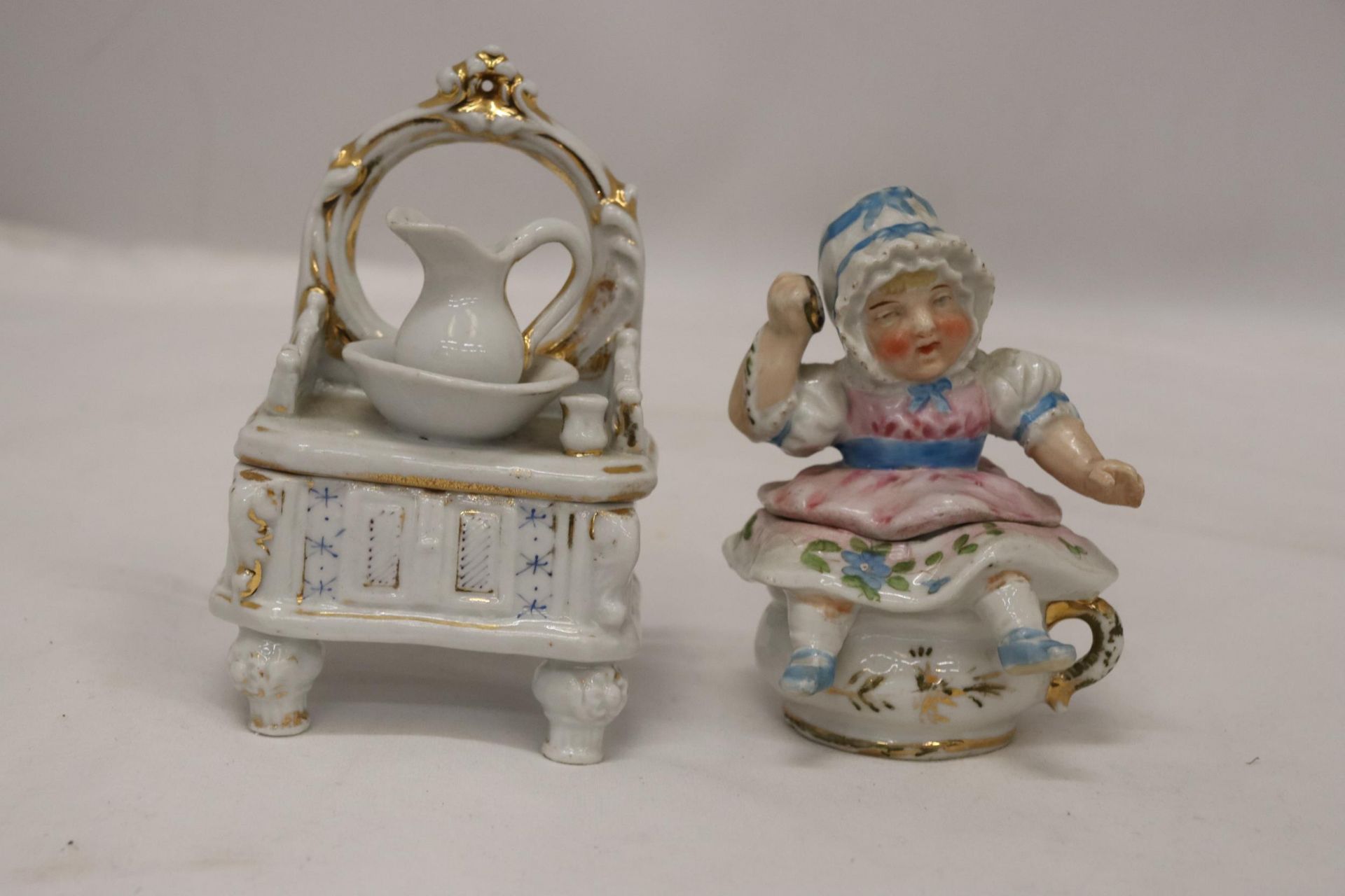 TWO ORIGINAL GERMAN CONTA AND BOHME TRINKET BOX FAIRINGS TO INCLUDE A DRESSING TABLE WITH WASH JUG