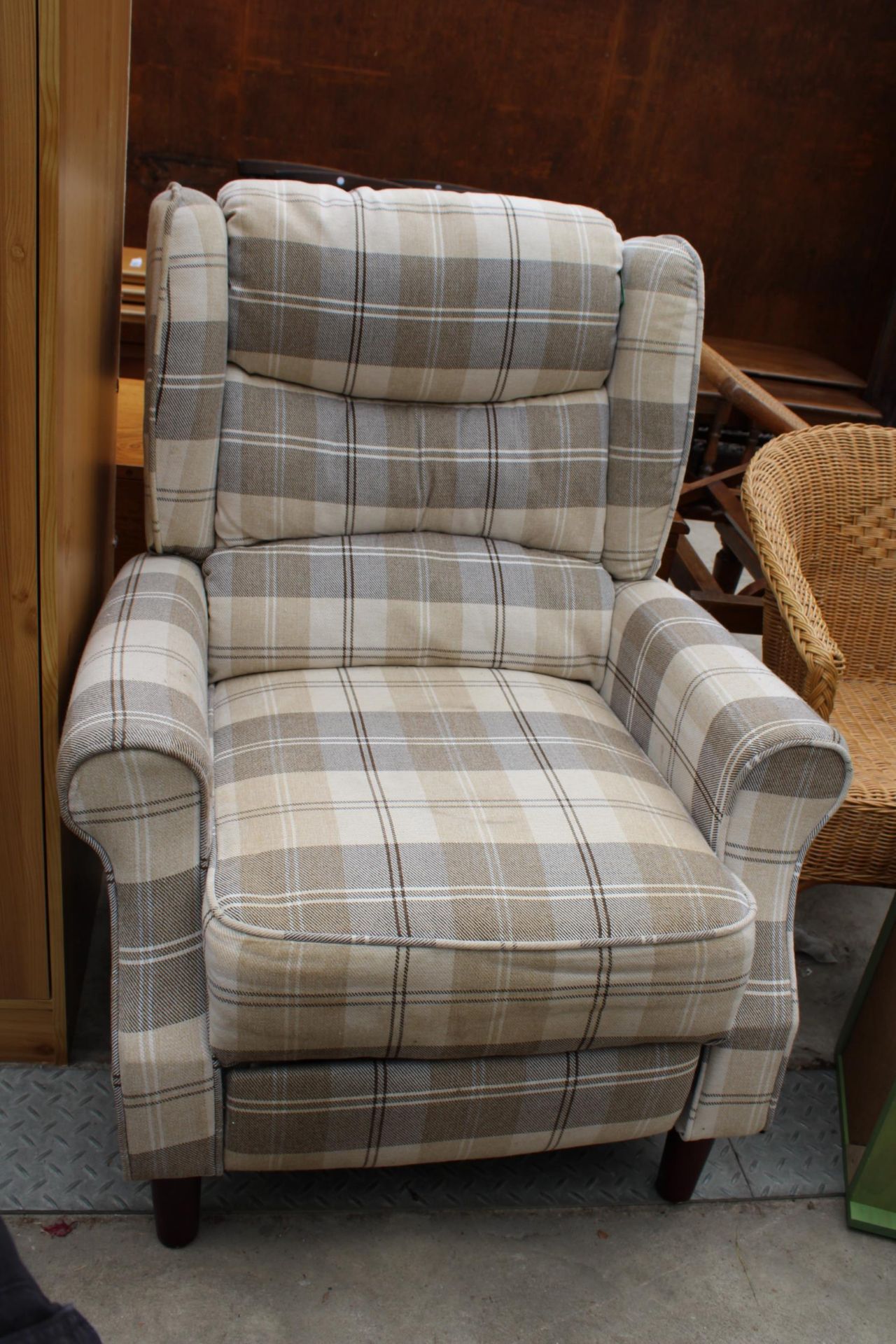 A CHECK WINGED RECLINER CHAIR
