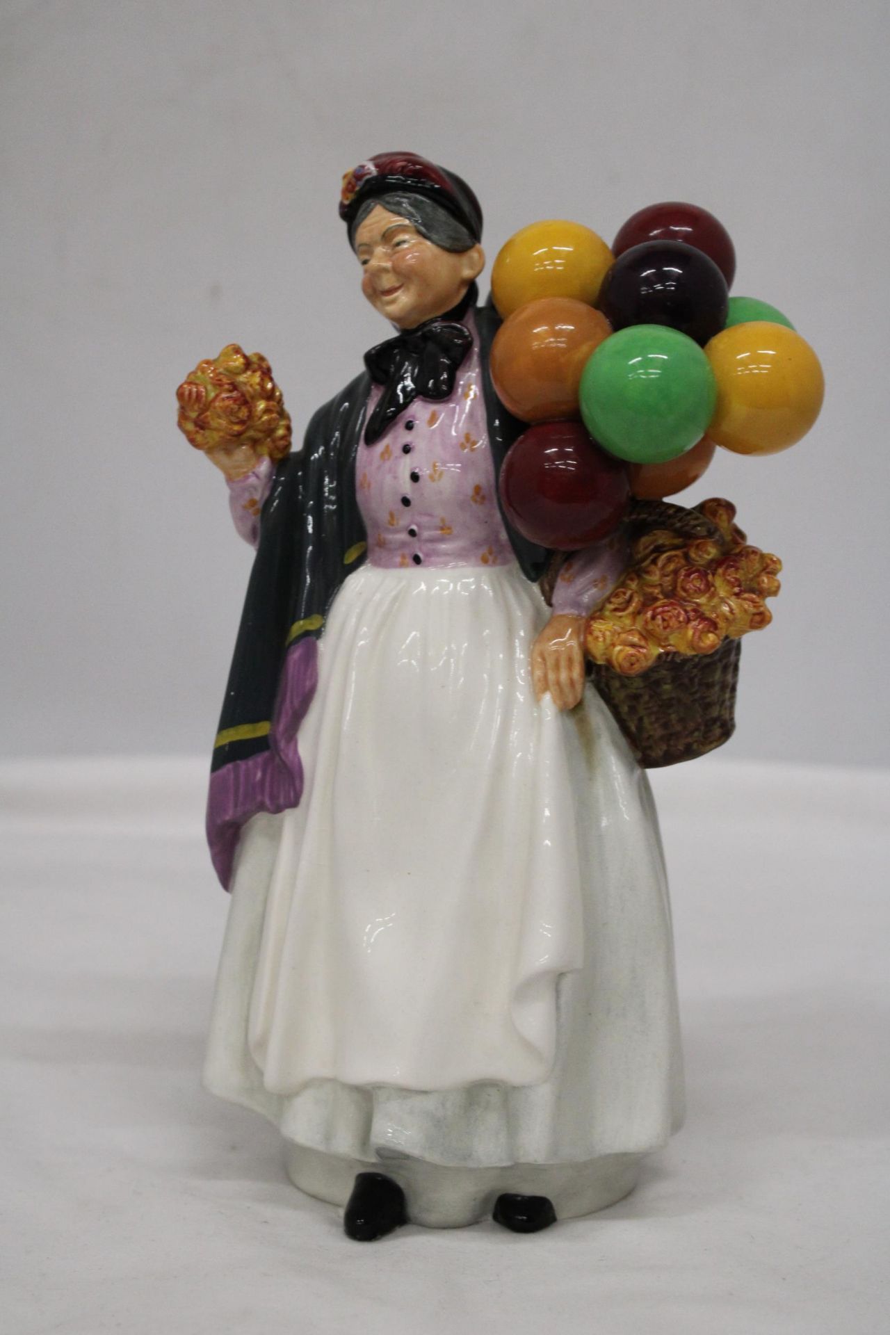 A ROYAL DOULTON FIGURE " BIDDY PENNY FARTHING" HN 1843 - Image 2 of 6