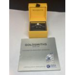 AN 18 CARAT WHITE GOLD RING WITH A 0.5 CARAT SOLITAIRE DIAMOND COMPLETE WITH GGI CERTIFICATE IN