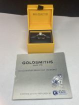 AN 18 CARAT WHITE GOLD RING WITH A 0.5 CARAT SOLITAIRE DIAMOND COMPLETE WITH GGI CERTIFICATE IN