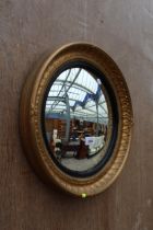 A MID 20TH CENTURY ATSONEA CONVEX GILT FRAMED WALL MIRROR, 16" DIAMETER