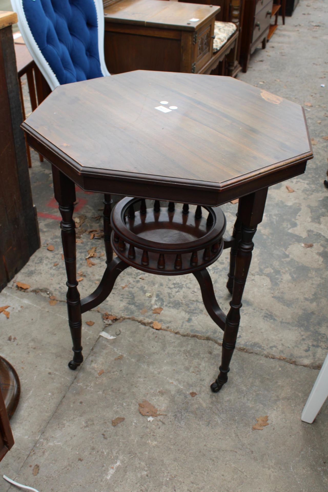 AN OCTAGONAL LATE VICTORIAN CENTRE TABLE WITH GALLERIED UNDER TIER, 27" ACROSS