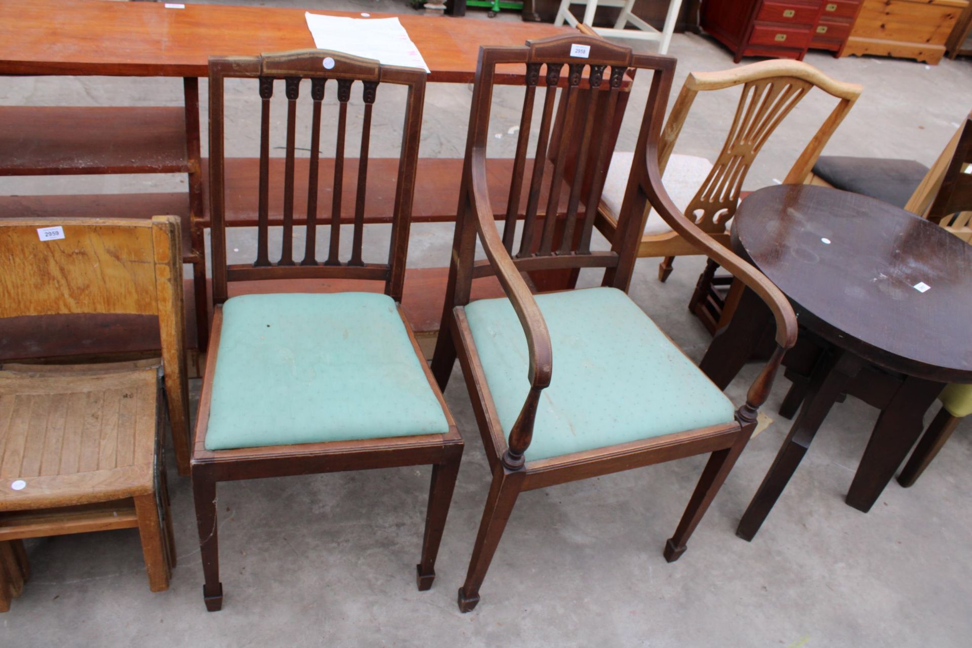 AN EDWARDIAN MAHOGANY AND INLAID CARVER CHAIR AND MATCHING DINING CHAIR