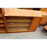 A RETRO TEAK GIBBS FURNITURE BOOKCASE ENCLOSING CUPBOARDS AND TWO GLASS SLIDING DOORS, 48" WIDE