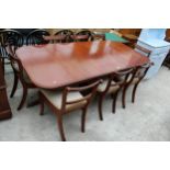 A MAHOGANY REGENCY STYLE EXTENDING TWIN PEDESTAL DINING TABLE 62" X 38" (LEAF 21") AND SIX BRASS