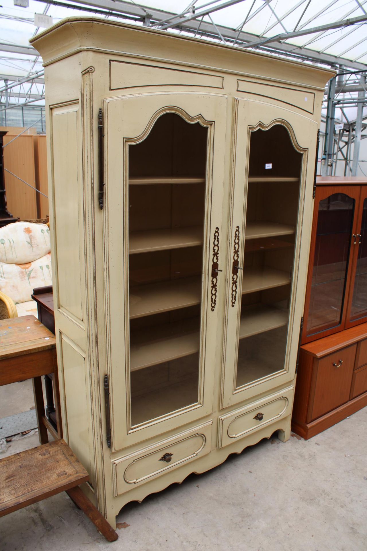 A MOEDERN WHITE PAINTED CONTINENTAL STYLE TWO DOOR GLAZED CABINET WITH TWO DRAWERS TO BASE 52" WIDE