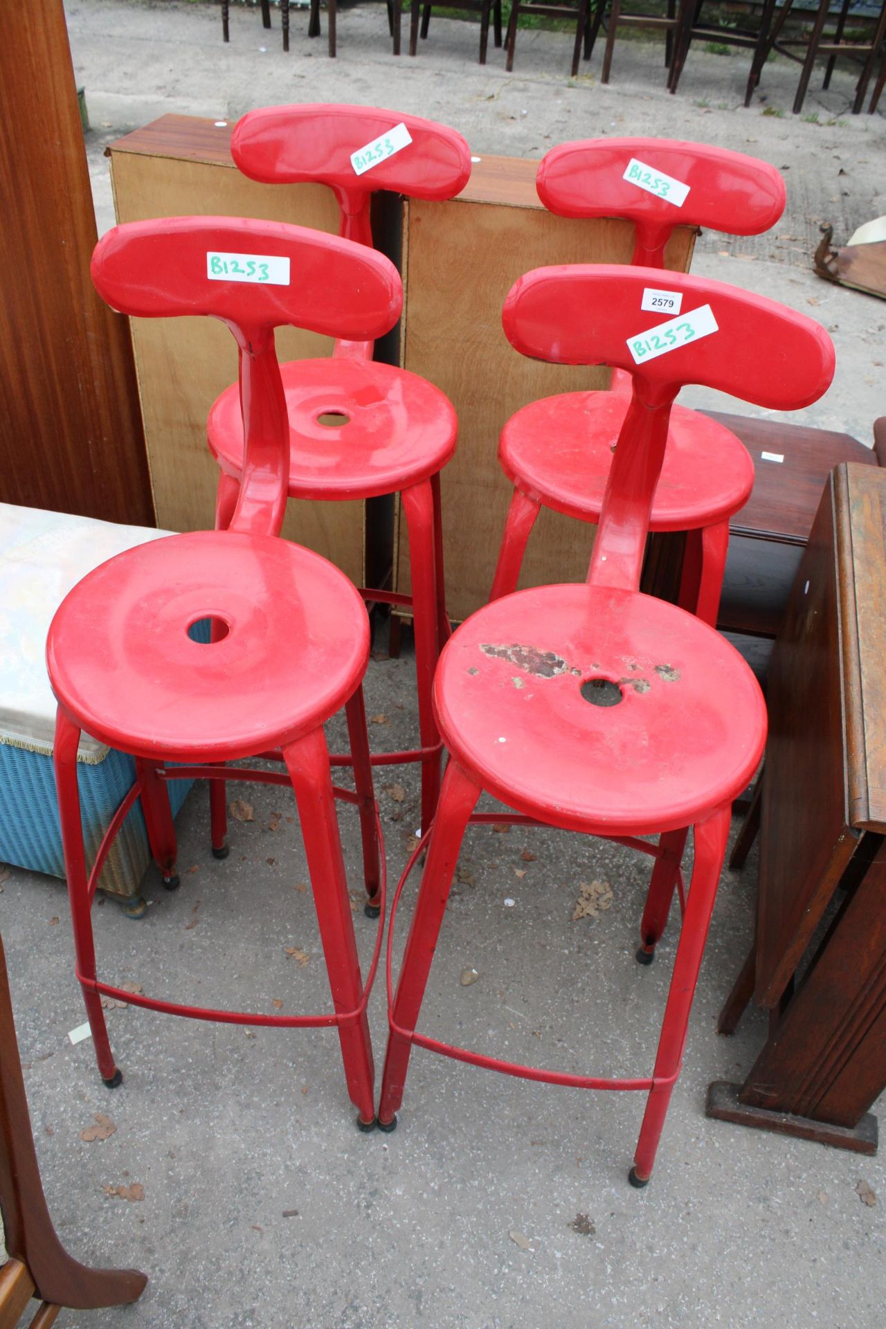 FOUR BRIGHT RED METALWARE HIGH BACK STOOLS