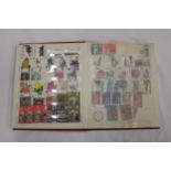 A STAMP ALBUM CONTAINING A VARIETY OF STAMPS TO INCLUDE SHIPS, AIRCRAFT, CHRISTMAS, EUROPEAN
