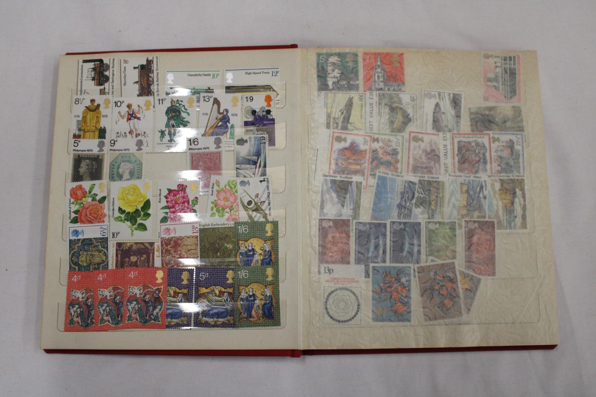 A STAMP ALBUM CONTAINING A VARIETY OF STAMPS TO INCLUDE SHIPS, AIRCRAFT, CHRISTMAS, EUROPEAN