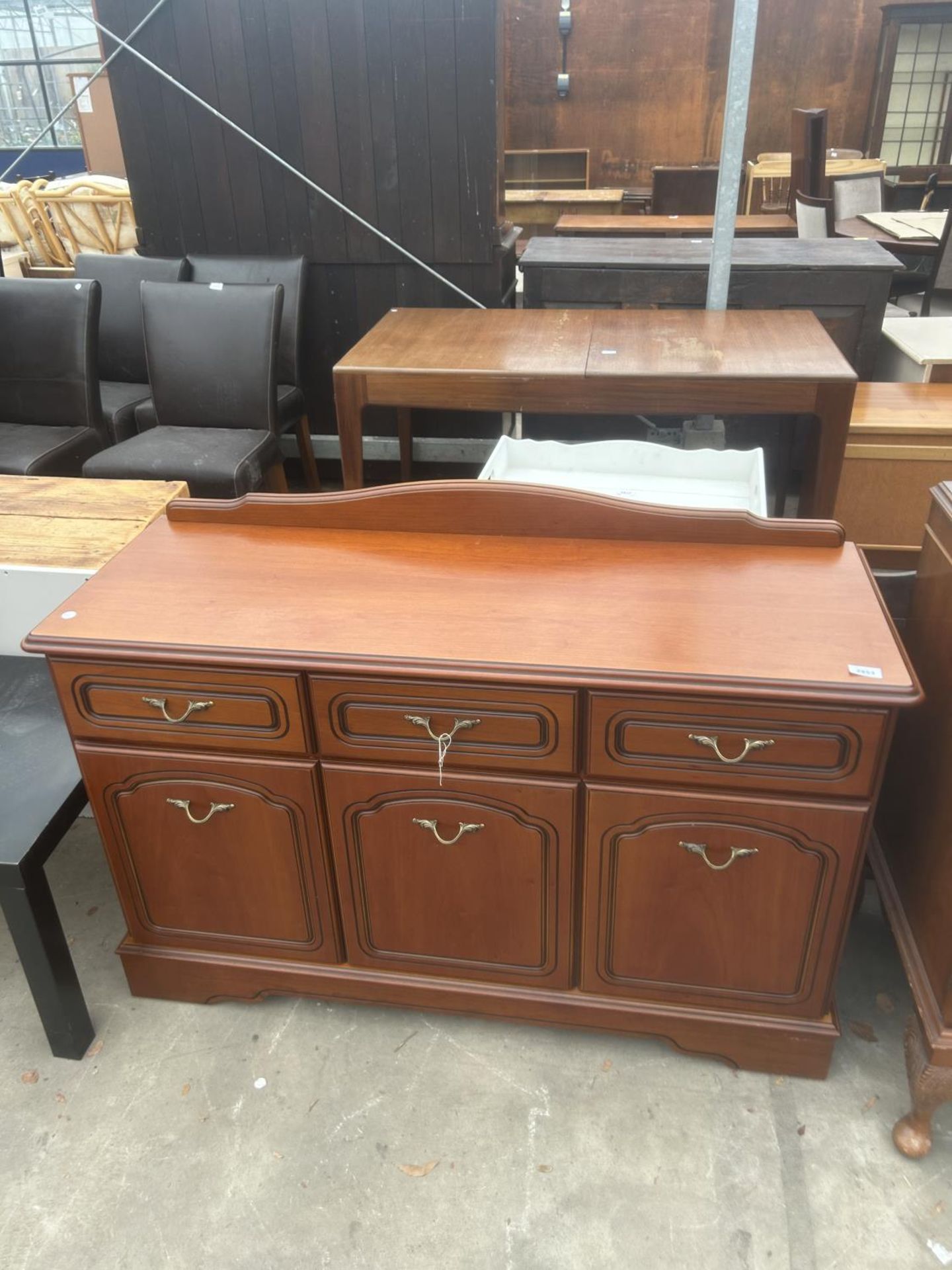 A CHERRY WOOD SIDEBOARD