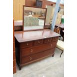 A STAG MINSTREL DRESSING CHEST ENCLOSING FOUR SHORT AND TWO LONG DRAWERS, 42" WIDE