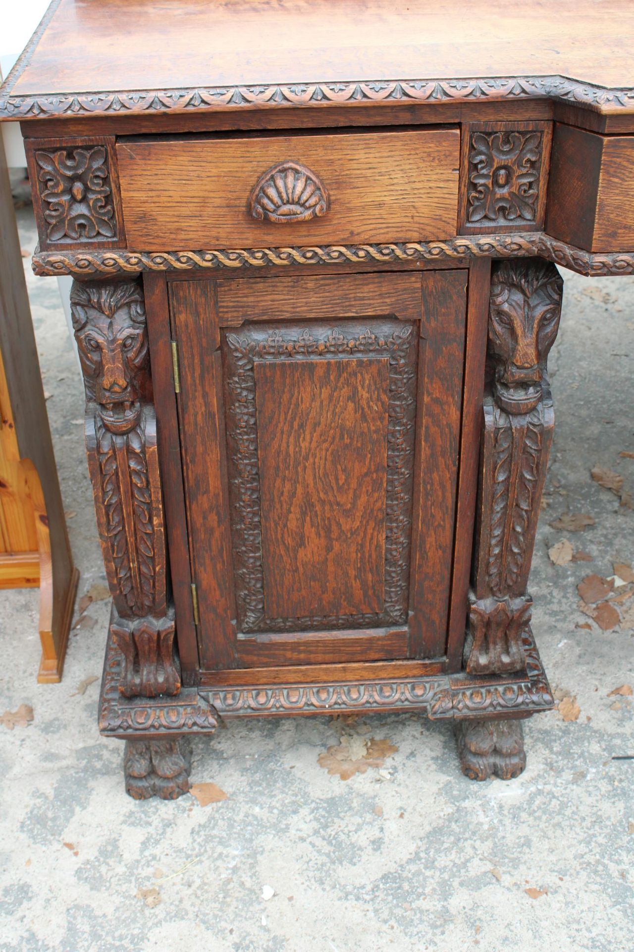 A VICTORIAN OAK BREAKFRONT SIDEBOARD ON CARVED CLAW FEET WITH CARVED PANELS WITH MYTHICAL - Image 3 of 4
