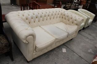 A MODERN CREAM FAUX LEATHER CHESTERFIELD THREE SEATER SETTEE