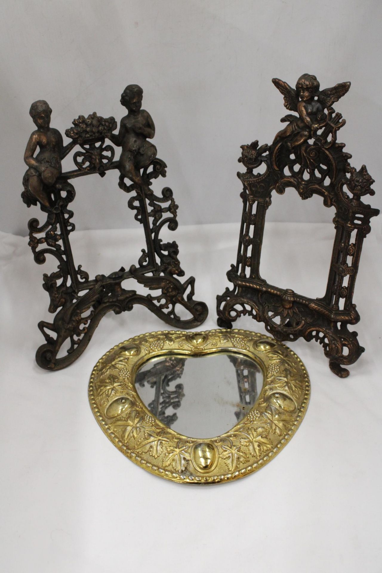TWO HEAVY VINTAGE BRASS PHOTO FRAMES WITH ORNATE DECORATION AND REGISTRATION NUMBER TO THE BACK,
