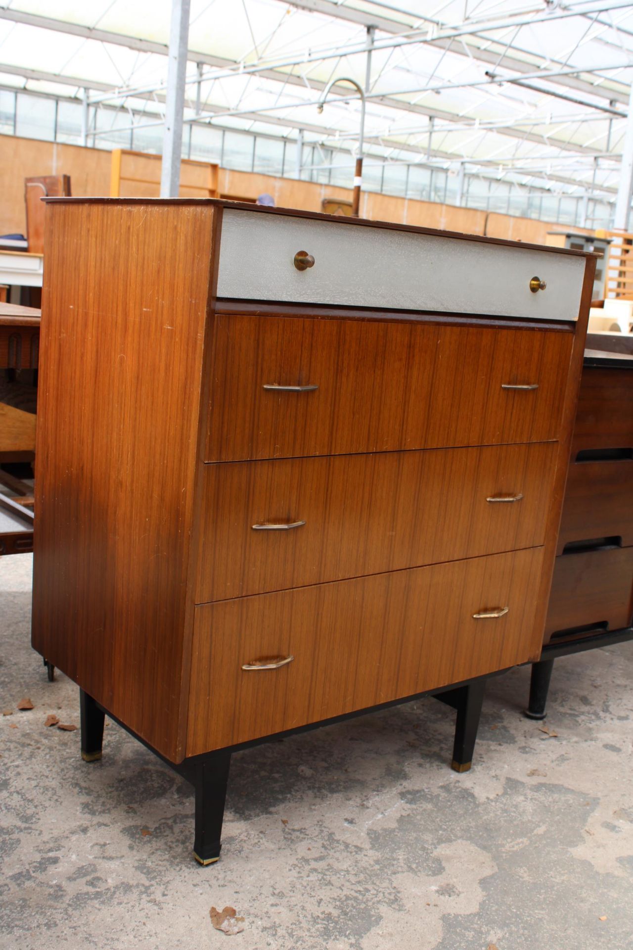 A RETRO TEAK CHEST OF FOUR DRAWERS, THE TOP DRAWER BEING SILVER COLOURED, ALL WITH BRASS HANDLES - Image 3 of 3