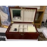 A WOODEN JEWELLERY BOX WITH INLAY TO THE TOP INCLUDES KEY AND AS NEW IN BOX