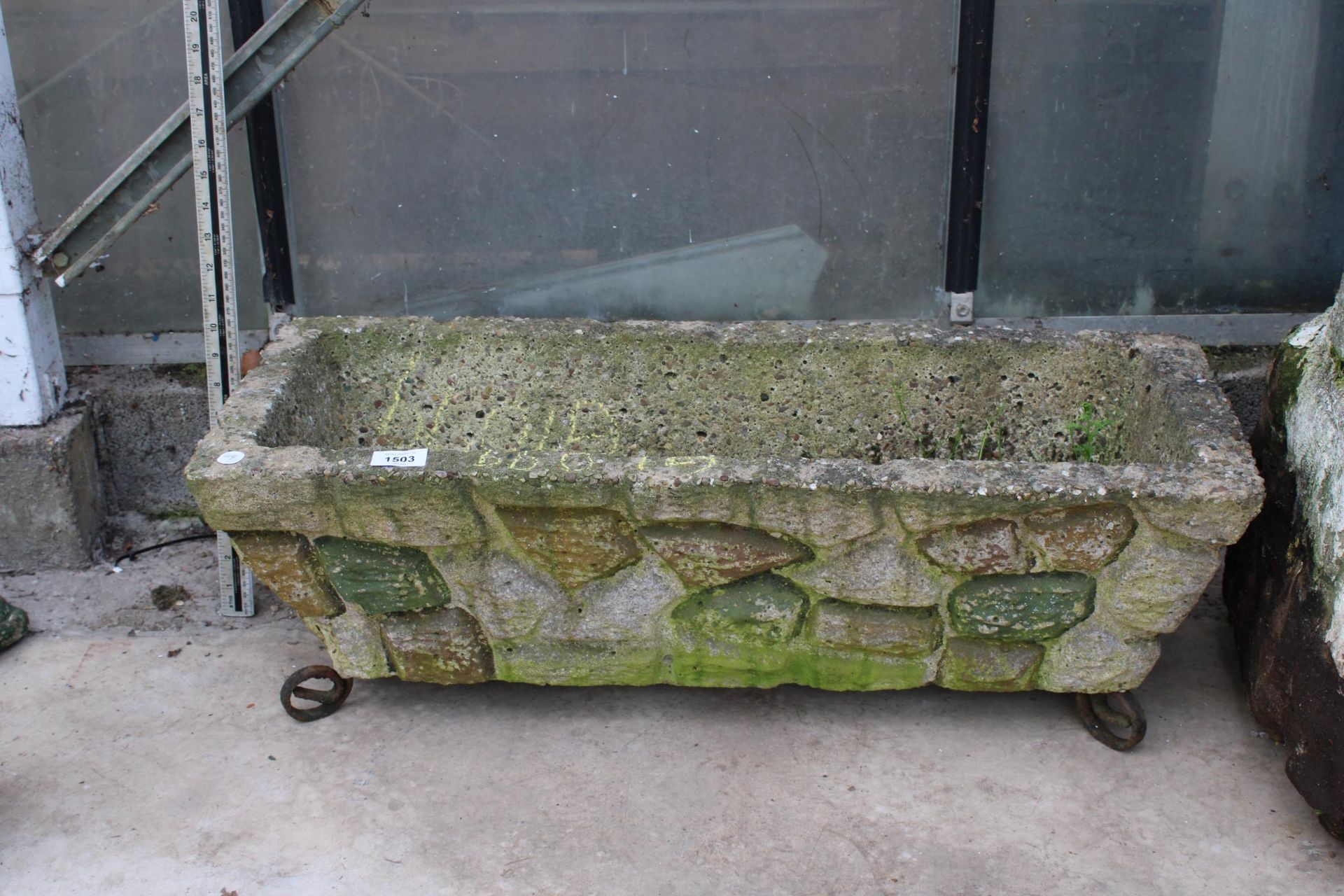 A CONCRETE GARDEN TROUGH PLANTER WITH METAL FEET (L:75CM)