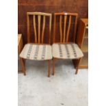 A PAIR OF RETRO TEAK DINING CHAIRS