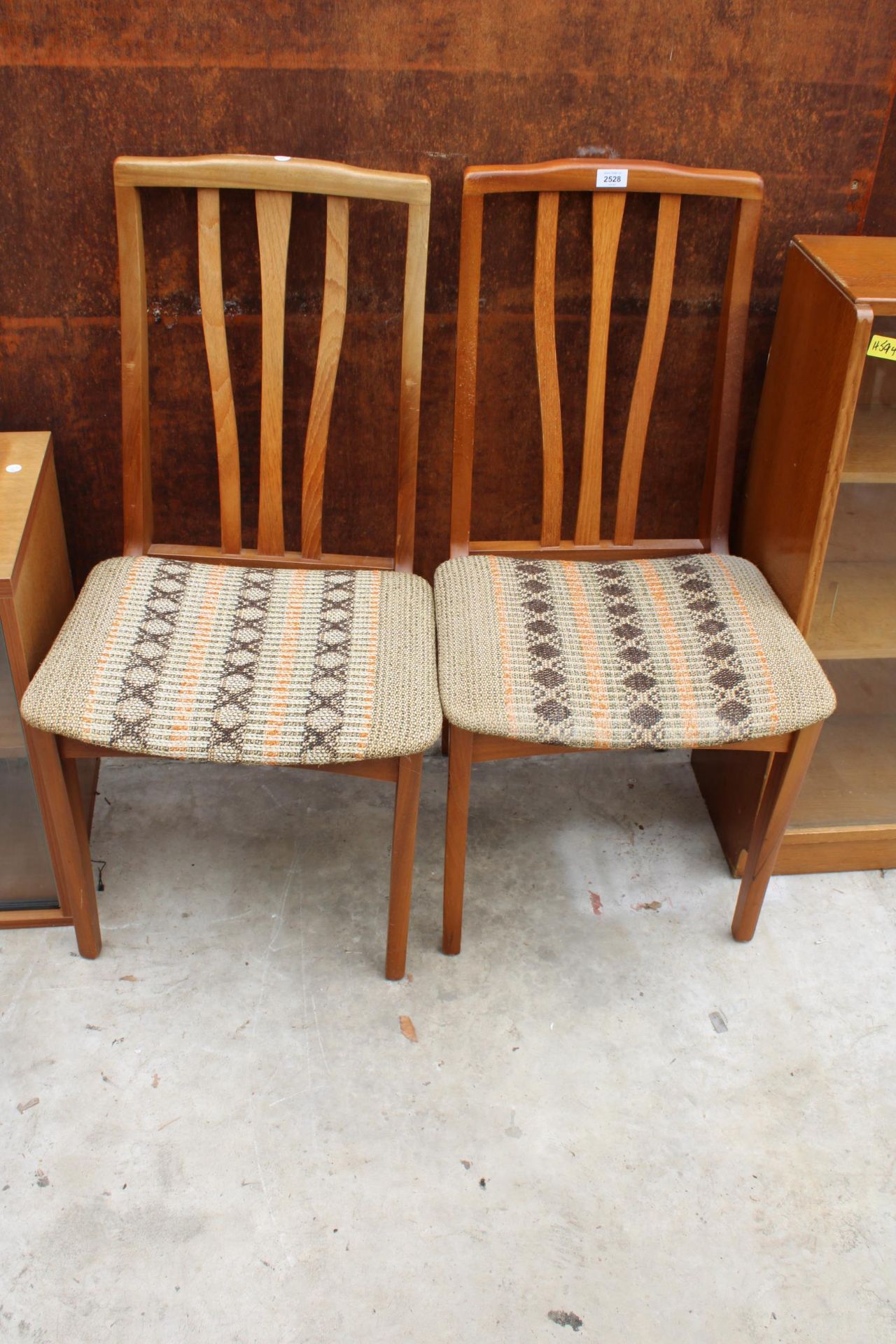 A PAIR OF RETRO TEAK DINING CHAIRS