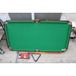 A TABLE TOP POOL TABLE, CUES AND BALLS ETC