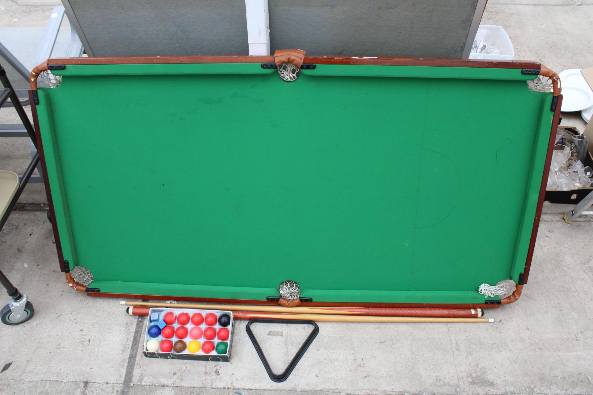 A TABLE TOP POOL TABLE, CUES AND BALLS ETC