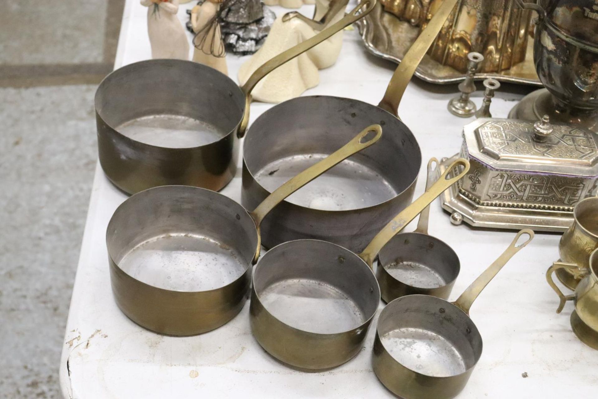 SIX VINTAGE GRADUATED SAUCEPANS